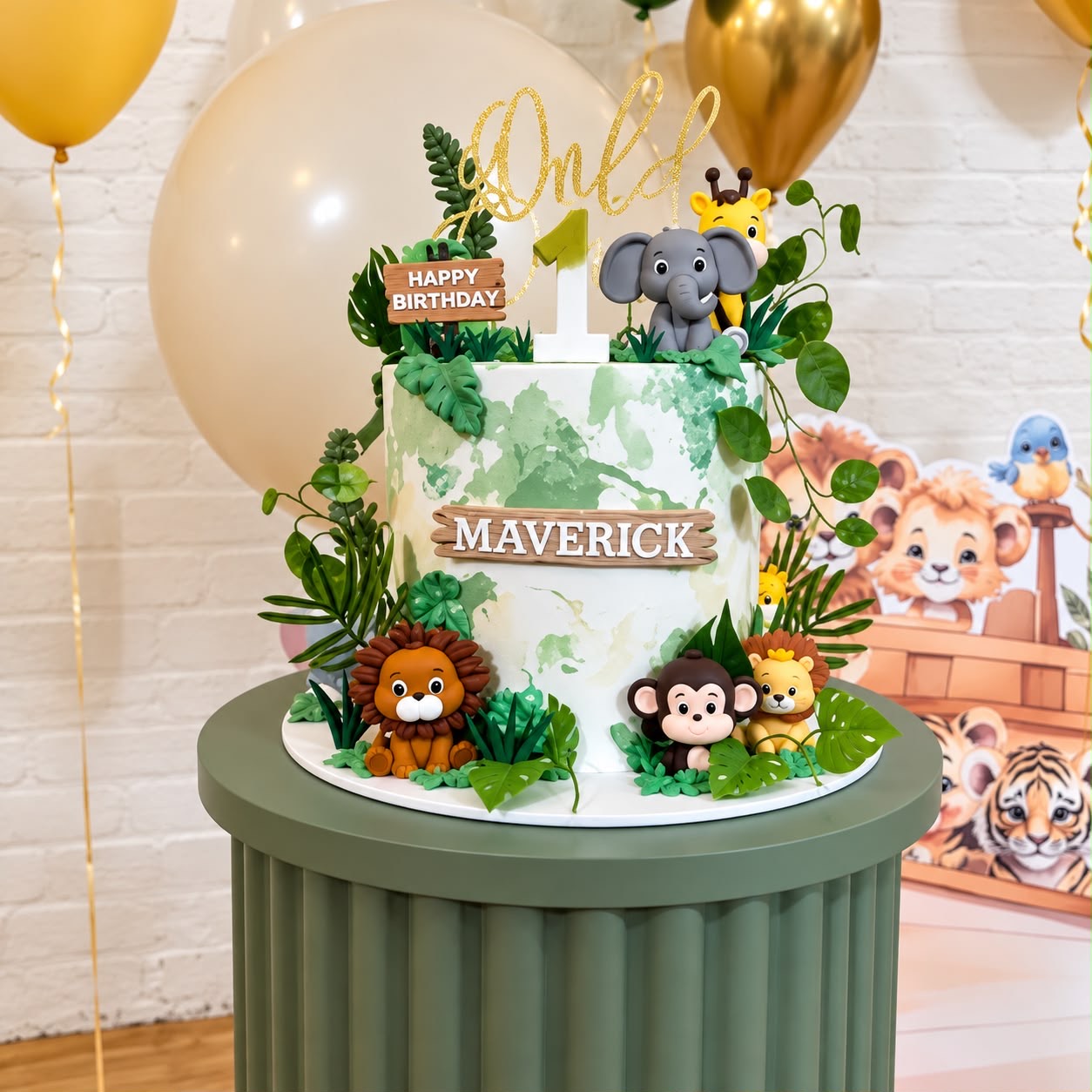 A first birthday cake decorated with jungle animals and green leaves